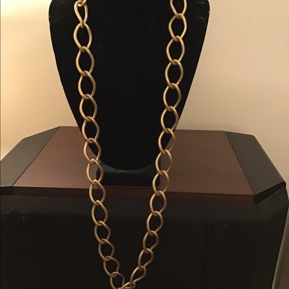 Gold tone chain necklace.